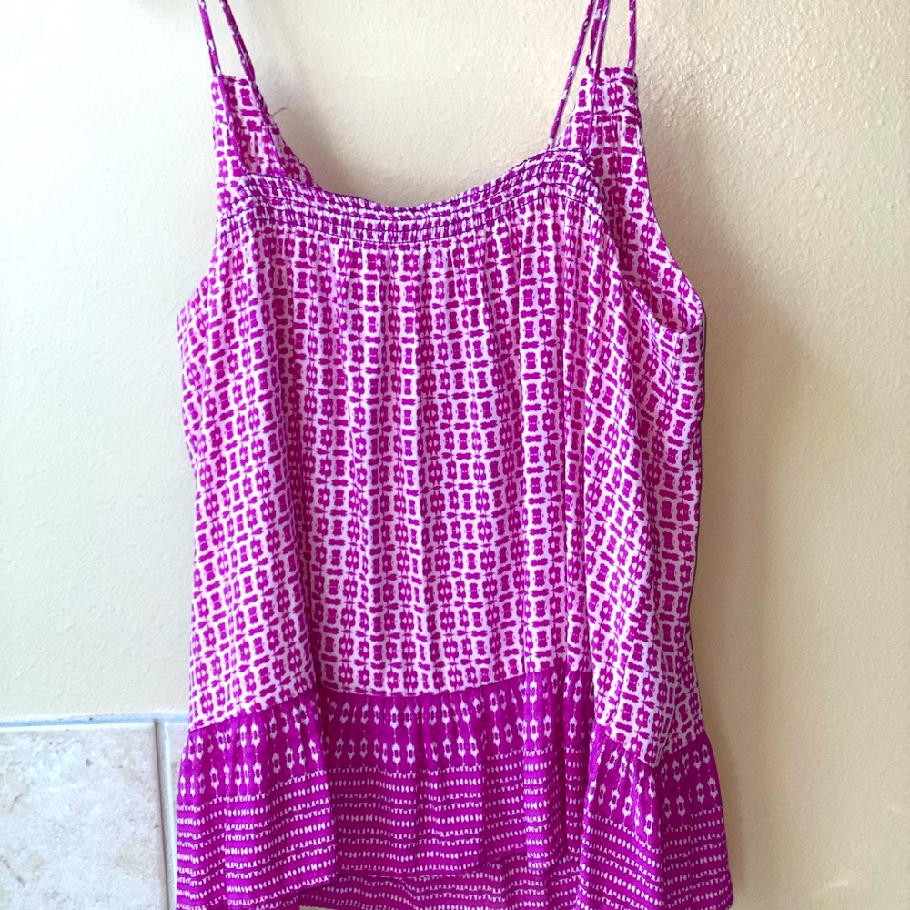 Flowy printed top. Double straps. Hits at hips.